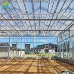 Hot dip galvanized steel frame full glass greenhouse construction site